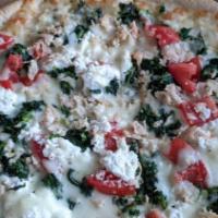 Margherita Pizza White · Sliced tomatoes, fresh mozzarella, fresh basil, and mozzarella cheese.