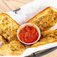 Garlic Bread · Homemade garlic sauce spread over French bread and toasted to a delicious crisp.