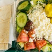 Greek Salad · Feta cheese over garden salad with side of homemade Greek dressing. Served with pita bread.