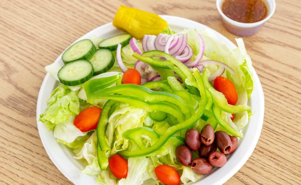 Garden Salad · Fresh onions, tomatoes, kalamata olives, green peppers and cucumber over lettuce with side homemade vinaigrette. Served with pita bread.