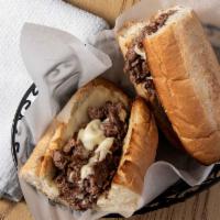 Cheese Steak Sub · Grilled Angus steak topped with melted American cheese on toasted French bread.