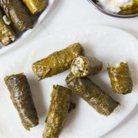 Stuffed Grape Leaves · Vegan. Stuffed grape leaves filled with rice, onions, and tomatoes cooked with olive oil.