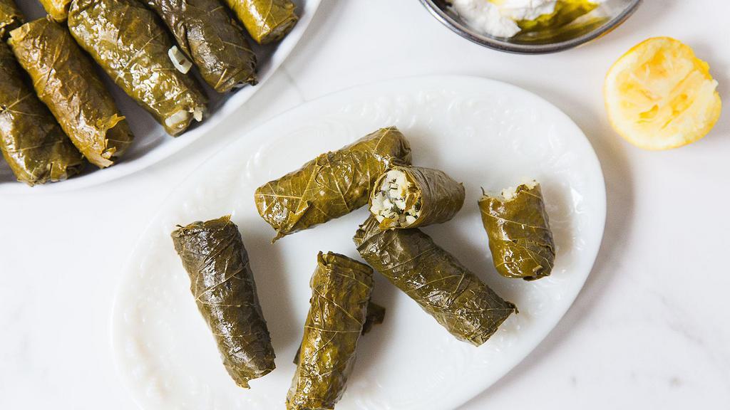 Stuffed Grape Leaves · Vegan. Stuffed grape leaves filled with rice, onions, and tomatoes cooked with olive oil.