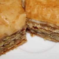 Classic Baklava · Thin layers of baked phyllo dough stuffed with almonds, walnuts, honey, and syrup.