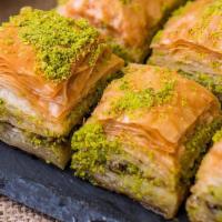 Pistachio Baklava · Buttery, flaky puff pastry soaked in honey and sugar with tender pistachios stuffed between ...