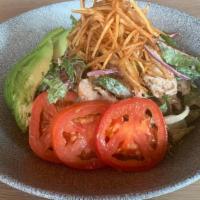 Ensalada Bacan · Roasted Pulled chicken, mixed greens, cucumber, avocado, tomatoes, shoestring potatoes, hous...