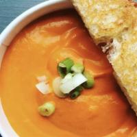 Tomato Bisque · creamy tomato soup served with garlic toast