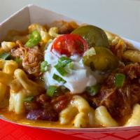 Chili Mac · House mac topped with pork chili, jalapeno, green onion and a dollop of sour cream.