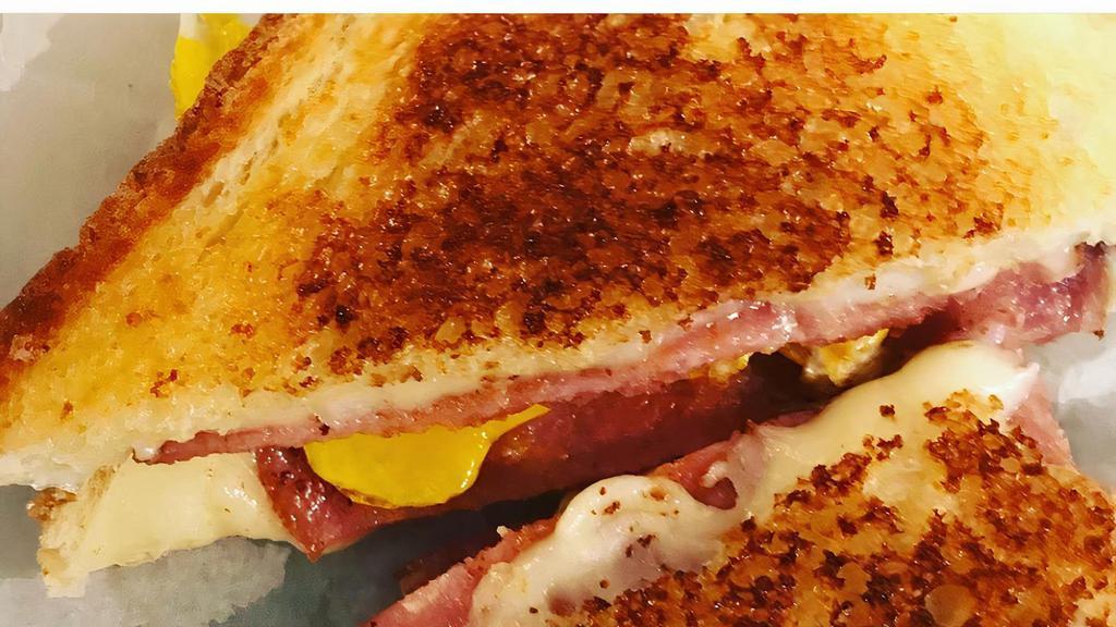 Breakfast Grilled Cheese · White bread, American cheese, a fried egg and your choice of pork roll, bacon or tomato.