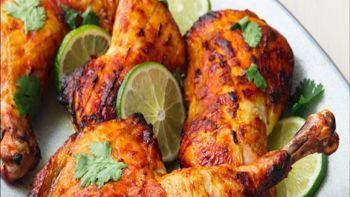 Tandoor Chicken · Chicken leg quarters marinated in yogurt, fresh spices and lemon juice then cooked in the cl...