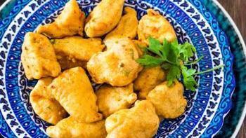 Chicken Pakora · Tender pieces of chicken dipped in mildly spiced lentil batter and fried.