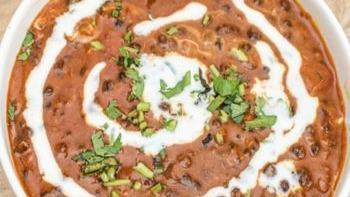 Dal Makhani · Black lentils cooked overnight on a very slow fire flavored with butter, tomato, fenugreek l...