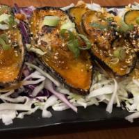 Fire Mussel · Grilled mussels with spicy masago sauce