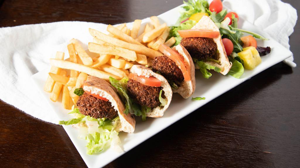Falafel Sandwich · Fresh home-made falafel in pita served with lettuce, tomato, cucumber, and tahini sauce.