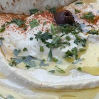 Hummus · Ground chick peas with garlic, tahini and lemon. Served with pita wedges.