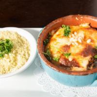 Moussaka · Layered eggplant, ground beef, tomato sauce, and topped with cheese bechamel sauce. Served w...