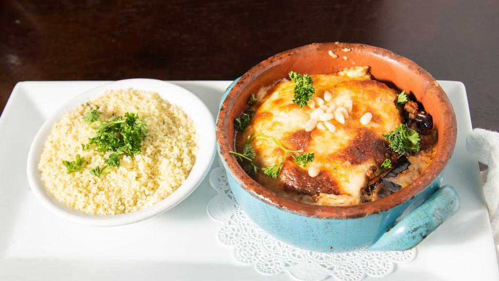 Moussaka · Layered eggplant, ground beef, tomato sauce, and topped with cheese bechamel sauce. Served with rice or couscous.