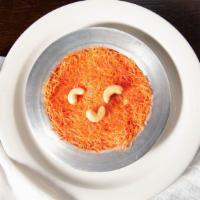 Knafeh · Sweet white cheese covered with semolina wheat mixed topped with honey and rose water.