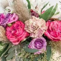 Bohemian Flair · A beautiful arrangement of colorful blooms textural foliages accented with fluffy pampas gra...