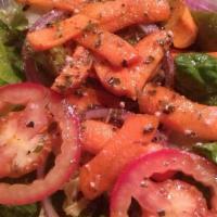 House Salad · A delicious mixture of romaine lettuce, plum tomatoes, red onions, Italian olives & marinate...
