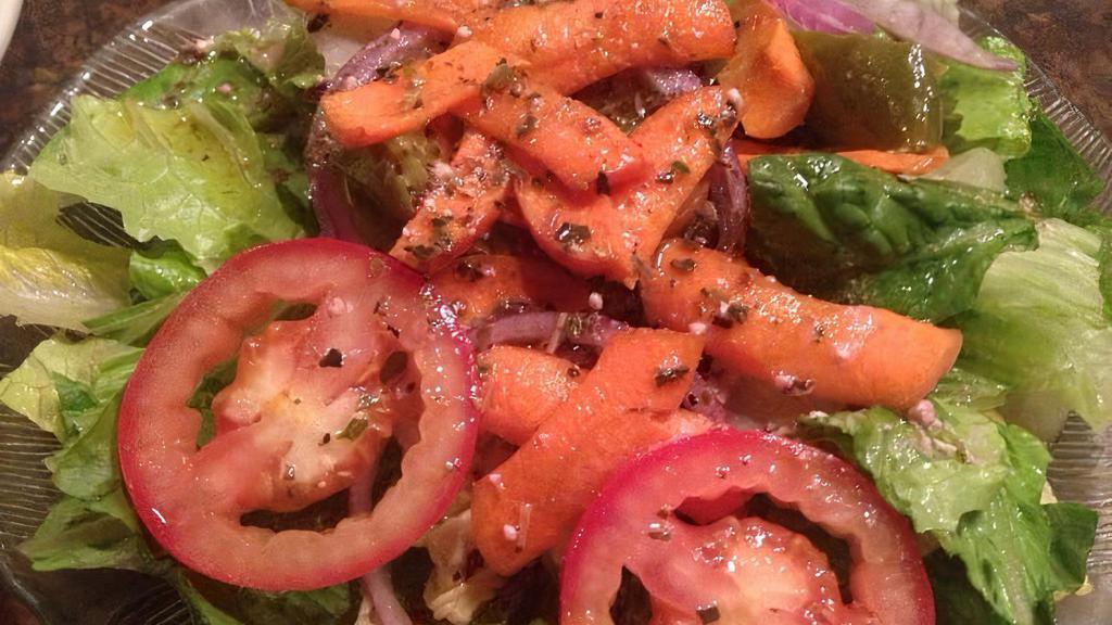 House Salad · A delicious mixture of romaine lettuce, plum tomatoes, red onions, Italian olives & marinated roasted peppers, topped with our vinaigrette dressing.