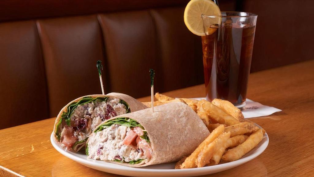Chicken Salad Blt Wrap · Our homemade chicken salad with dried cranberries and walnuts, lettuce, tomatoes and bacon wrapped in a honey wheat flour tortilla.