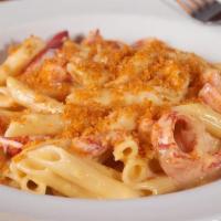 Lobster Mac & Cheese · Maine lobster meat tossed with a creamy cheese and baked with a buttery cracker crumb crust.