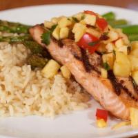 Tropical Grilled Salmon · Fresh grilled Atlantic salmon topped with our fresh pineapple salsa and served with asparagu...