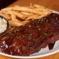Bbq Baby Back Ribs · Full rack of our slow roasted Hickory BBQ Pork Ribs served with homemade coleslaw and french...