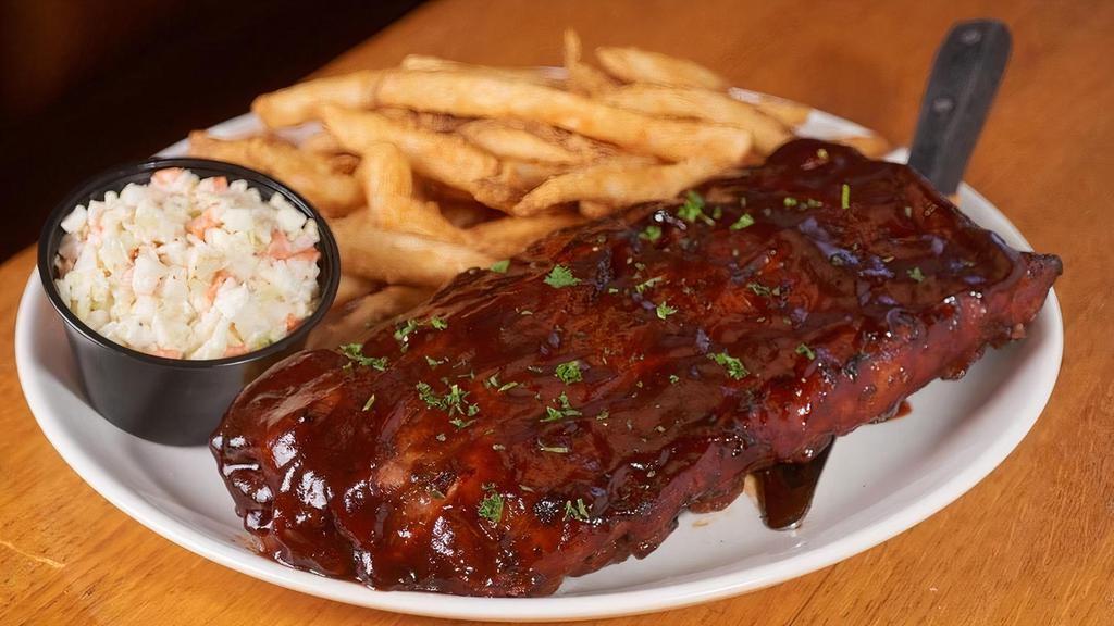 Bbq Baby Back Ribs · Full rack of our slow roasted Hickory BBQ Pork Ribs served with homemade coleslaw and french fries.