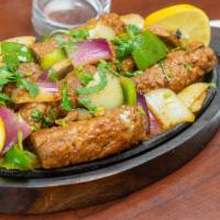 Chicken Kabab · Marinated chicken cooked on skewer in clay oven.
