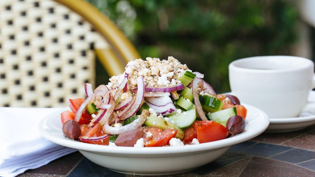 Greek Villager’S Salad (Horiatiki) · The olives and feta cheese add a pungent touch, but the salad is still refreshing. (tomatoes, cucumbers, red onion, feta cheese, and olives) Dressed with our & Traditional Greek Vinaigrette. Choice of size.