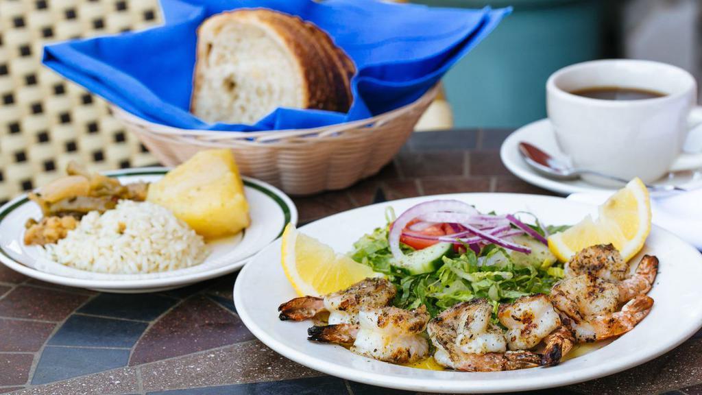 Shrimp Poseidon · Roasted over charcoal grill with olive oil, oregano  and lemon.