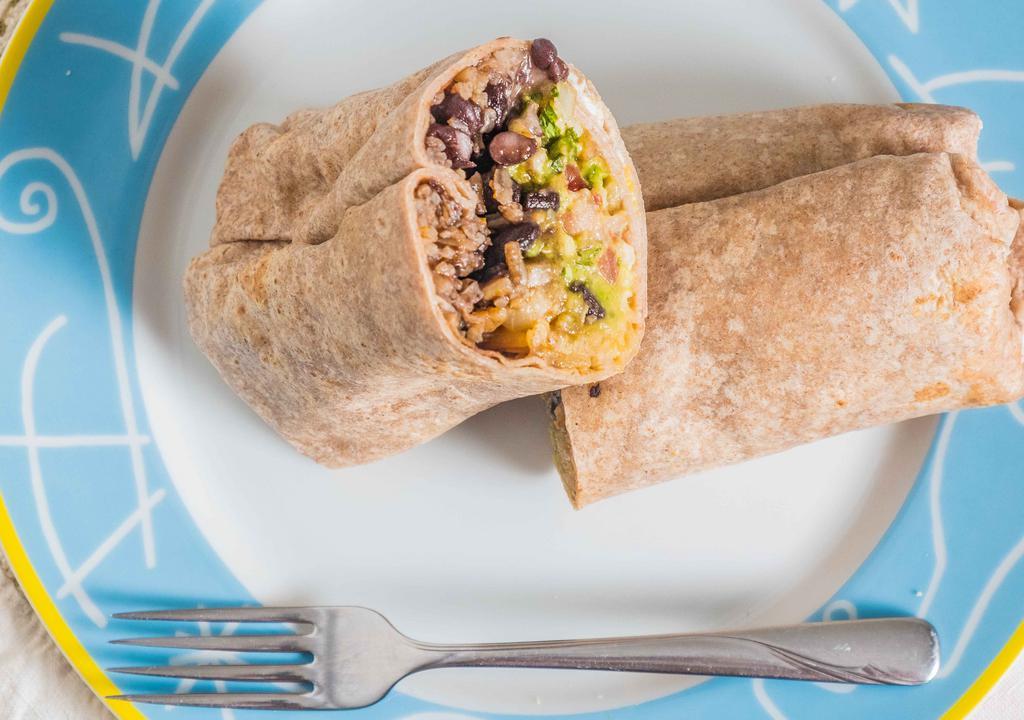 Veggie Burrito · Rice, black beans, lettuce, tomato, salsa, sour cream, cheese and guacamole on a wheat tortilla.