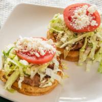 Sope (Single) · Small handmade fried tortilla, choice of meat, refried beans, lettuce, tomato, cheese, tomat...
