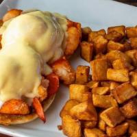Online Lobster Benedict · Two poached eggs served open face on poached lobster on English muffins topped with hollanda...