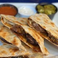 Online Steak Quesadilla · Grilled flour tortilla pressed with grilled marinated steak tips and melted cheddar cheese i...