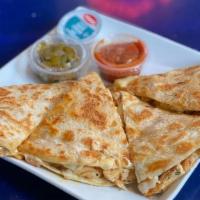 Online Chicken Quesadilla · Grilled flour tortilla pressed with grilled marinated chicken and melted cheddar cheese insi...