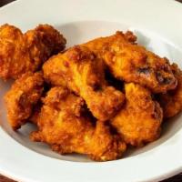 Online Buffalo Wings · Breaded fried chicken wings tossed in hot buffalo sauce with choice of dipping sauce.