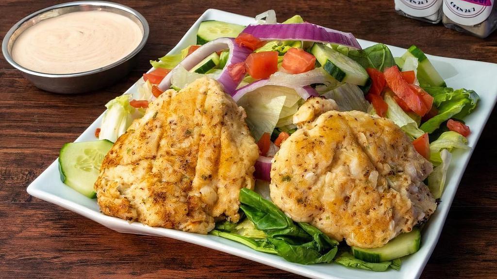 Online Crab Cakes And Salad · Homemade lump crab cakes served with side of remoulade sauce and a side salad with balsamic dressing