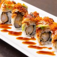 Dragon Roll · Eel on top with avocado and shrimp tempura inside.