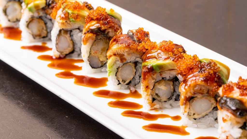 Dragon Roll · Eel on top with avocado and shrimp tempura inside.