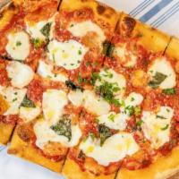 Classic Margarita Pizza · Fresh mozzarella, basil, and tomato sauce.