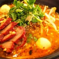 Tom Yum Noodle Soup · Spicy. May contain peanuts. Thai style tom yum broth, rice noodle, roasted pork, ground pork...