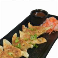 Gyoza (6) · Available vegan. Steamed or fried dumpling filled with chicken and pork, scallions, and ging...