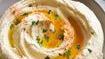 Hummus · Grounded chickpeas topped with olive oil and served with pita.