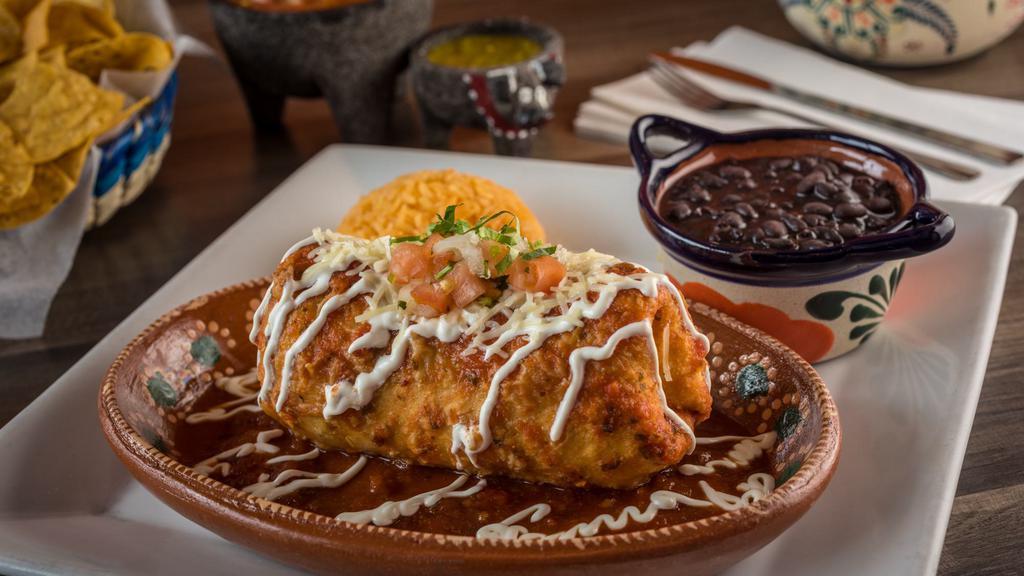 Chimichanga Plate · Fried burrito stuffed with rice, beans, cheese, salsa, and Pico de gallo, topped with salsa and sour cream and your choice of meat or veggies.