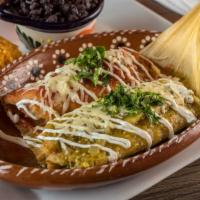 Tamales Plate · Steamed cornmeal with poblano peppers and cheese, Chicken or Pork, topped with sour cream an...