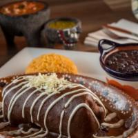 Burrito Poblano · Flour tortilla stuffed with rice, beans, cheese, topped with mole sauce and sour cream and y...