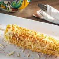 Mexican Street Corn · Fresh steamed corn on the cob topped with mayo and cheese, sprinkled with tajin chili powder.